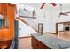 Kitchen with stainless appliances, an island, and stairs to the second floor at 2213 Spanish Vistas Dr, Dunedin, FL 34698