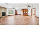 Open living space with a stone fireplace, red front door, and built-in cabinetry at 2213 Spanish Vistas Dr, Dunedin, FL 34698