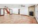 Spacious living room featuring a stone fireplace, large tile flooring and lots of natural light at 2213 Spanish Vistas Dr, Dunedin, FL 34698