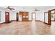Bright living space features red door, large tile flooring, and built-in cabinetry at 2213 Spanish Vistas Dr, Dunedin, FL 34698