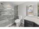 Updated bathroom features a glass-enclosed shower and modern fixtures at 2333 Feather Sound Dr # A204, Clearwater, FL 33762