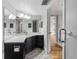 A well-lit bathroom with double sinks, modern fixtures, and a glass-enclosed shower at 2333 Feather Sound Dr # A204, Clearwater, FL 33762