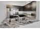 This kitchen features granite countertops with a stainless steel sink and faucet at 2333 Feather Sound Dr # A204, Clearwater, FL 33762