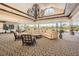 Spacious lobby featuring comfortable seating, elegant chandelier, and expansive windows offering natural light at 2333 Feather Sound Dr # A204, Clearwater, FL 33762