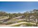 Scenic view of the parking lot, mature trees, and landscaping around the community at 2333 Feather Sound Dr # A204, Clearwater, FL 33762