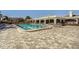 A community pool with tables, chairs, and an expansive deck at 2333 Feather Sound Dr # A204, Clearwater, FL 33762
