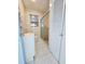 Bathroom featuring tiled shower, toilet, vanity and storage at 2422 W State St, Tampa, FL 33609