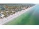 Breathtaking aerial shot of the beach with clear turquoise waters and soft white sand at 300 16Th Ave, Indian Rocks Beach, FL 33785