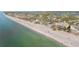 Beautiful aerial view of the beach and shoreline with a mix of residential and commercial buildings at 300 16Th Ave, Indian Rocks Beach, FL 33785