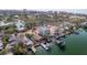 Waterfront home boasts a boat dock and lush landscaping near coastal scenery at 300 16Th Ave, Indian Rocks Beach, FL 33785