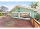 Spacious wooden deck offering waterfront views, enhanced by sliding windows on the home's exterior at 300 16Th Ave, Indian Rocks Beach, FL 33785