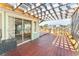 Home features sliding glass doors and a spacious deck with a pergola at 300 16Th Ave, Indian Rocks Beach, FL 33785