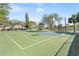 A community basketball court with green surface and blue accents for residents' outdoor recreation and enjoyment at 300 16Th Ave, Indian Rocks Beach, FL 33785