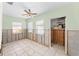 Spacious room with light green walls and tiled flooring, offering great potential for customization at 300 16Th Ave, Indian Rocks Beach, FL 33785