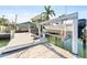 Home features a private dock with boat lift, providing access to water activities at 300 16Th Ave, Indian Rocks Beach, FL 33785