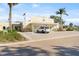 The Indian Rocks Beach library and auditorium is shown with ample parking, native palms, and attractive landscaping at 300 16Th Ave, Indian Rocks Beach, FL 33785