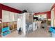 Kitchen area showing a refrigerator, oven, and partial view into other rooms, awaiting renovation at 300 16Th Ave, Indian Rocks Beach, FL 33785
