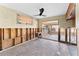 View of a large living room featuring tile flooring, a ceiling fan, and exposed wall studs at 300 16Th Ave, Indian Rocks Beach, FL 33785
