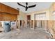 Open living area with tile flooring, ceiling fan, and views of an adjoining room, ready for renovation at 300 16Th Ave, Indian Rocks Beach, FL 33785