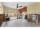 Open living area with tile flooring, ceiling fan, and views to the outside, ready for renovation at 300 16Th Ave, Indian Rocks Beach, FL 33785