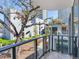 Charming balcony view, showcasing lush trees and modern architecture of the community at 3030 W Santiago St # 3, Tampa, FL 33629