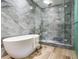 Stunning bathroom boasting a contemporary tub and walk-in shower with light grey tiling at 3030 W Santiago St # 3, Tampa, FL 33629