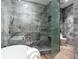 Luxurious bathroom featuring a sleek walk-in shower, modern fixtures, and light grey tiling at 3030 W Santiago St # 3, Tampa, FL 33629