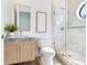 Modern bathroom with glass shower, marble vanity, and stylish fixtures at 3030 W Santiago St # 3, Tampa, FL 33629
