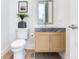 Stylish half bath features a modern vanity with stone countertop, sleek fixtures, and contemporary decor at 3030 W Santiago St # 3, Tampa, FL 33629