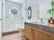 Modern bathroom with marble finishes, a glass-enclosed shower, and stylish fixtures at 3030 W Santiago St # 3, Tampa, FL 33629