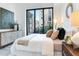 Bedroom featuring modern decor, large windows, and comfortable furnishings at 3030 W Santiago St # 3, Tampa, FL 33629