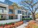 Modern condos with sleek architectural design, large windows, and lush landscaping, creating a serene outdoor living space at 3030 W Santiago St # 3, Tampa, FL 33629
