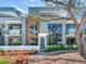Modern condo featuring sleek architectural design, large windows, and lush landscaping, creating a serene outdoor living space at 3030 W Santiago St # 3, Tampa, FL 33629