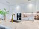 Modern kitchen featuring a large marble island with seating, stainless steel appliances, and stylish decor at 3030 W Santiago St # 3, Tampa, FL 33629