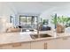 Modern kitchen featuring a large marble countertop with stainless steel sink, gold hardware, and white cabinets at 3030 W Santiago St # 3, Tampa, FL 33629