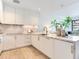 Modern kitchen featuring marble countertops, white cabinets, and stainless steel appliances at 3030 W Santiago St # 3, Tampa, FL 33629