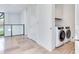 Bright laundry room featuring a modern washer and dryer set, with ample storage space, and a clean, minimalist design at 3030 W Santiago St # 3, Tampa, FL 33629