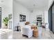 Bright living room with modern furniture, wood floors, and stylish decor accents at 3030 W Santiago St # 3, Tampa, FL 33629