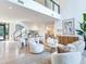 Bright, airy living room with high ceilings, modern furnishings, and seamless flow to the dining area and kitchen at 3030 W Santiago St # 3, Tampa, FL 33629