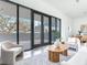 Open-concept living space with floor-to-ceiling windows and a contemporary design at 3030 W Santiago St # 3, Tampa, FL 33629