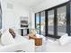 Bright, modern living room with large windows and a stylish seating arrangement at 3030 W Santiago St # 3, Tampa, FL 33629