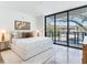 Serene main bedroom with a large window view, light neutral tones, and modern furnishings at 3030 W Santiago St # 3, Tampa, FL 33629