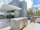 Large outdoor kitchen with bar seating, sink, and grill; great for entertaining at 3030 W Santiago St # 3, Tampa, FL 33629