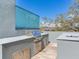 Well-equipped outdoor kitchen with a stainless steel grill and ample counter space at 3030 W Santiago St # 3, Tampa, FL 33629