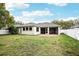 Backyard featuring a screened patio and a well-maintained lawn at 3206 Hurley Grove Way, Valrico, FL 33596