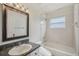 Traditional bathroom with a vanity, mirror, and a shower/tub combo at 3206 Hurley Grove Way, Valrico, FL 33596