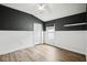 Neutral bedroom with a ceiling fan, window, closet, and vinyl flooring at 3206 Hurley Grove Way, Valrico, FL 33596