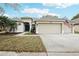 Charming single-story home with a two-car garage, well-maintained lawn, and a welcoming front entrance at 3206 Hurley Grove Way, Valrico, FL 33596