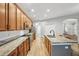 Modern kitchen with stainless steel appliances, ample cabinet space, and granite countertops at 3206 Hurley Grove Way, Valrico, FL 33596