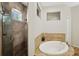 This ensuite bathroom has an oval soaking tub with tile surround, plus a tiled shower with glass door at 3206 Hurley Grove Way, Valrico, FL 33596
